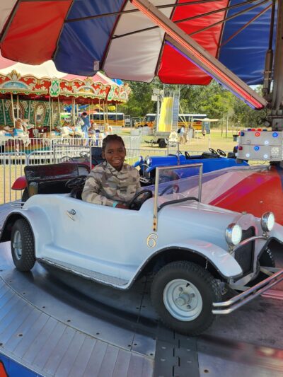 Boy in the attraction cars