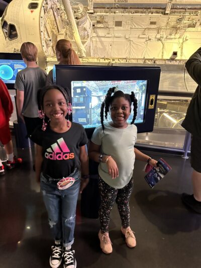 little girls in the space center