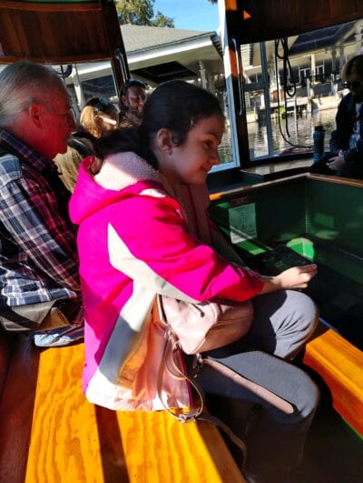 girl looking at the lake from the boat