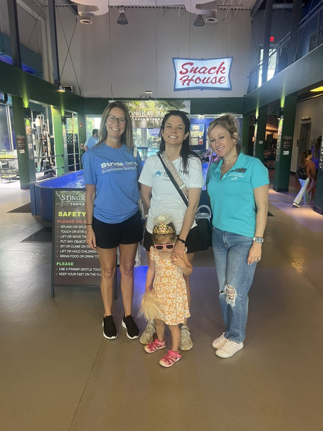 teachers with little girl smiling at the museum