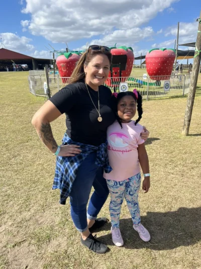 teacher with girl student in the park