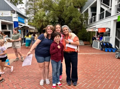 Happy kids and teachers in the zoo