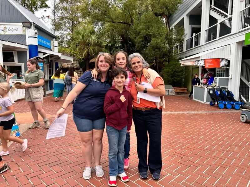 Happy kids and teachers in the zoo