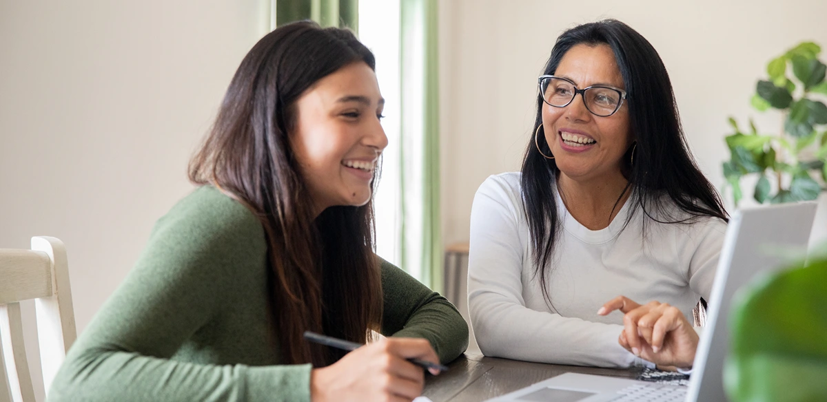 girls studying and smiling