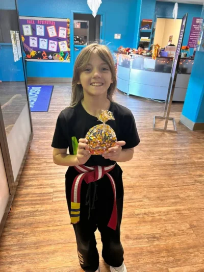 Smiling child in a karate uniform