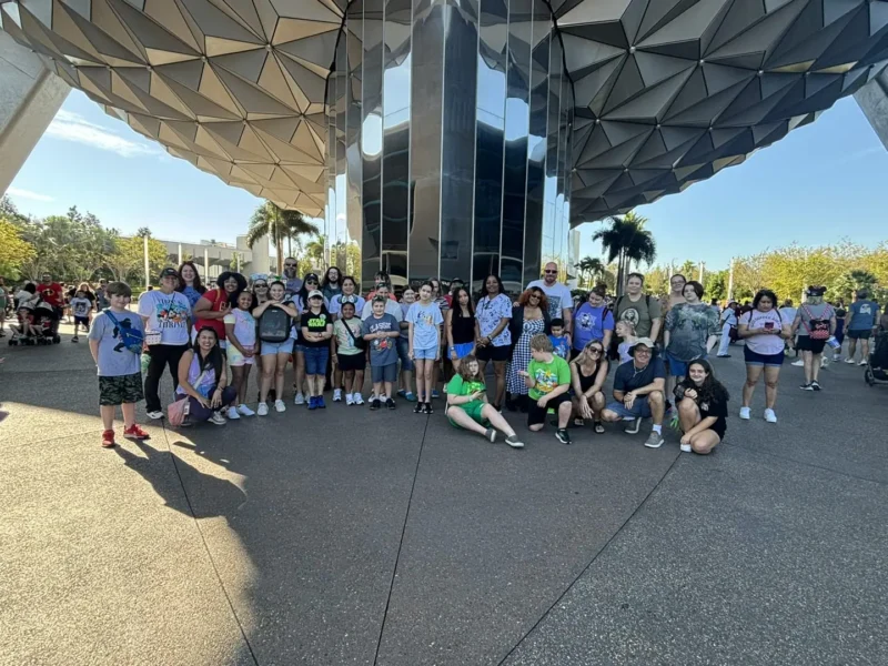 students and family in the photo in epcot
