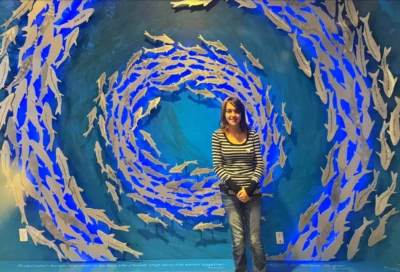 A smiling person at the aquarium