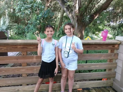 Two girls smiling for a pinture